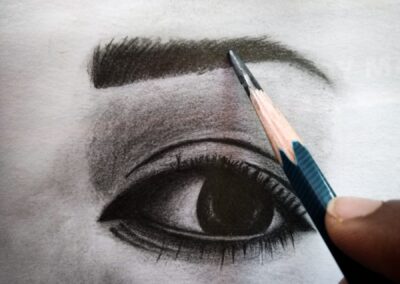 person holding blue and white pen