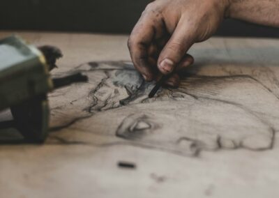 person holding black paint brush